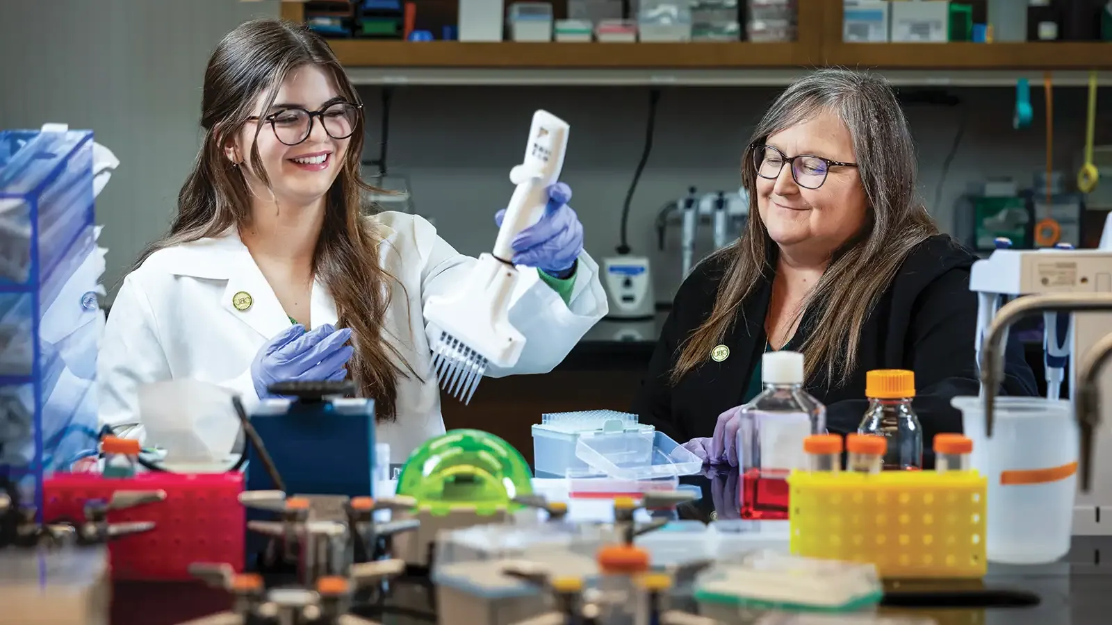 Dr. Judith James and Austin Lopez in a medical research laboratory